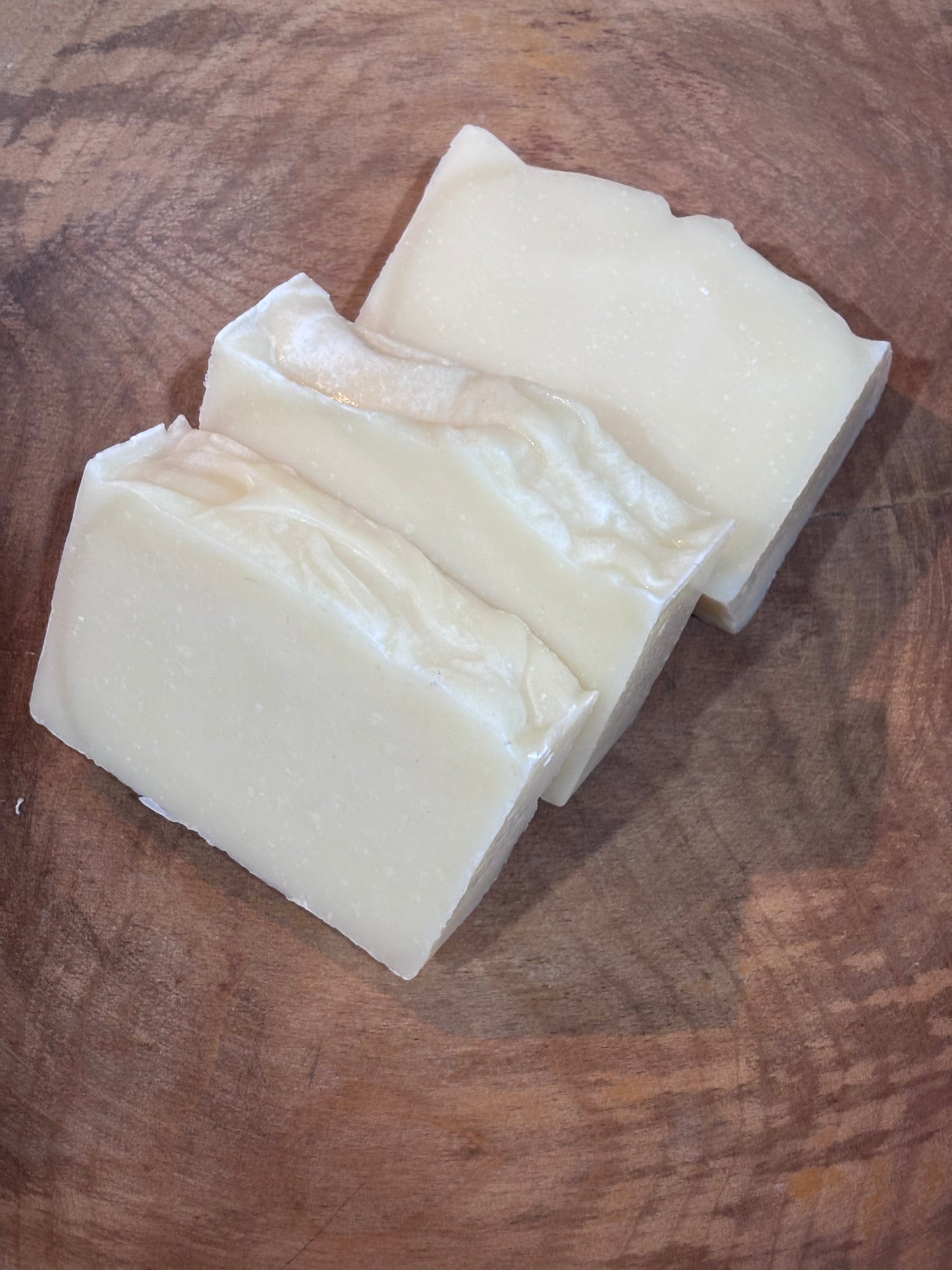 Creamy unscented soap in a wooden bowl. This is the recipe I created for my Son. Ingredients: distilled water, saponified oils of olive, palm, coconut and castor and nothing else. Weight is approx 5 oz.
