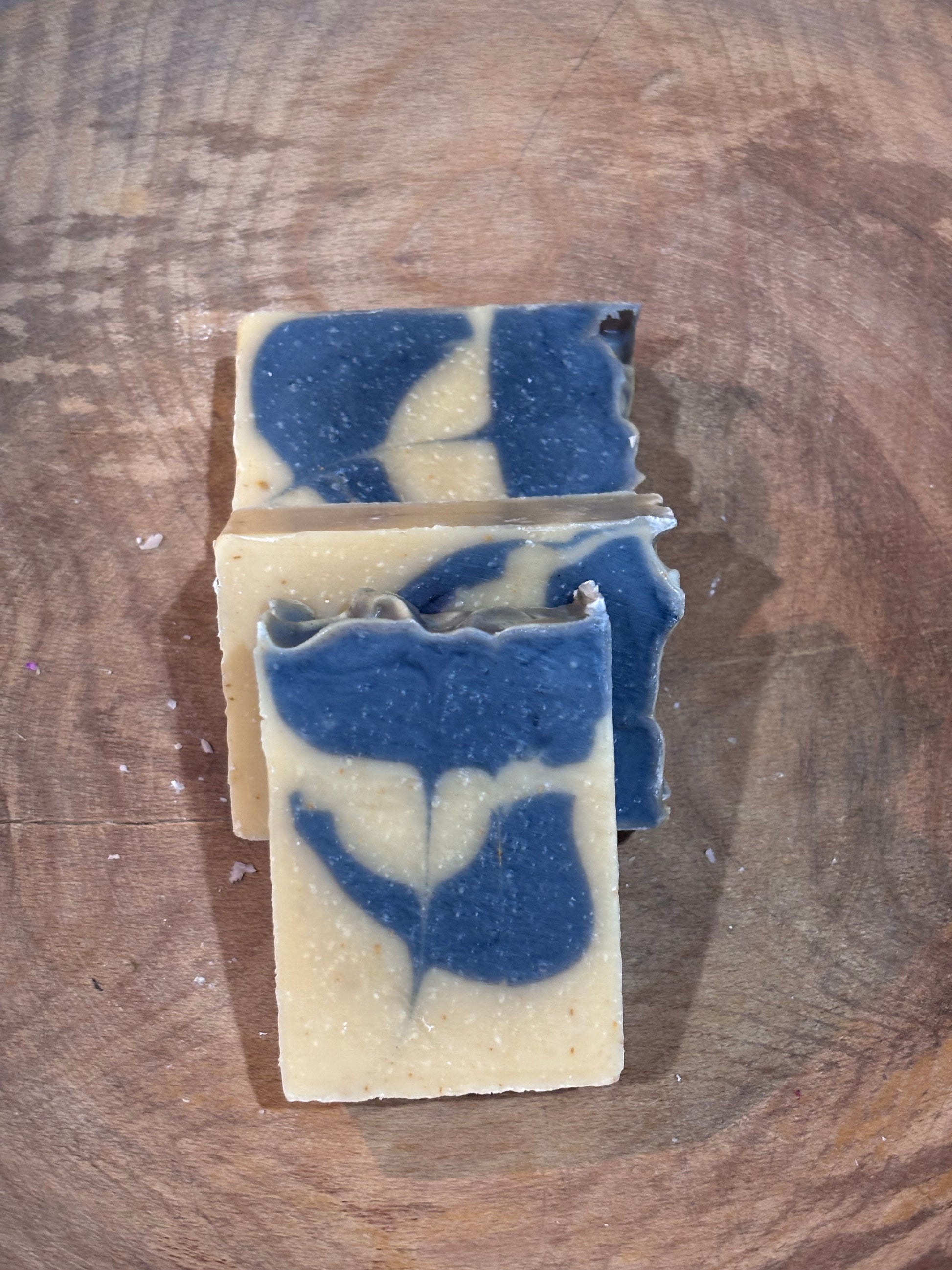 3 bars of Cedar Bloom soap  colored with yellow brazilian clay and blue indigo powder. Ingredients include saponified oils of olive, palm, coconut and castor as well as essential oils of lavender, bergamot, cedarwood, and juniper. 