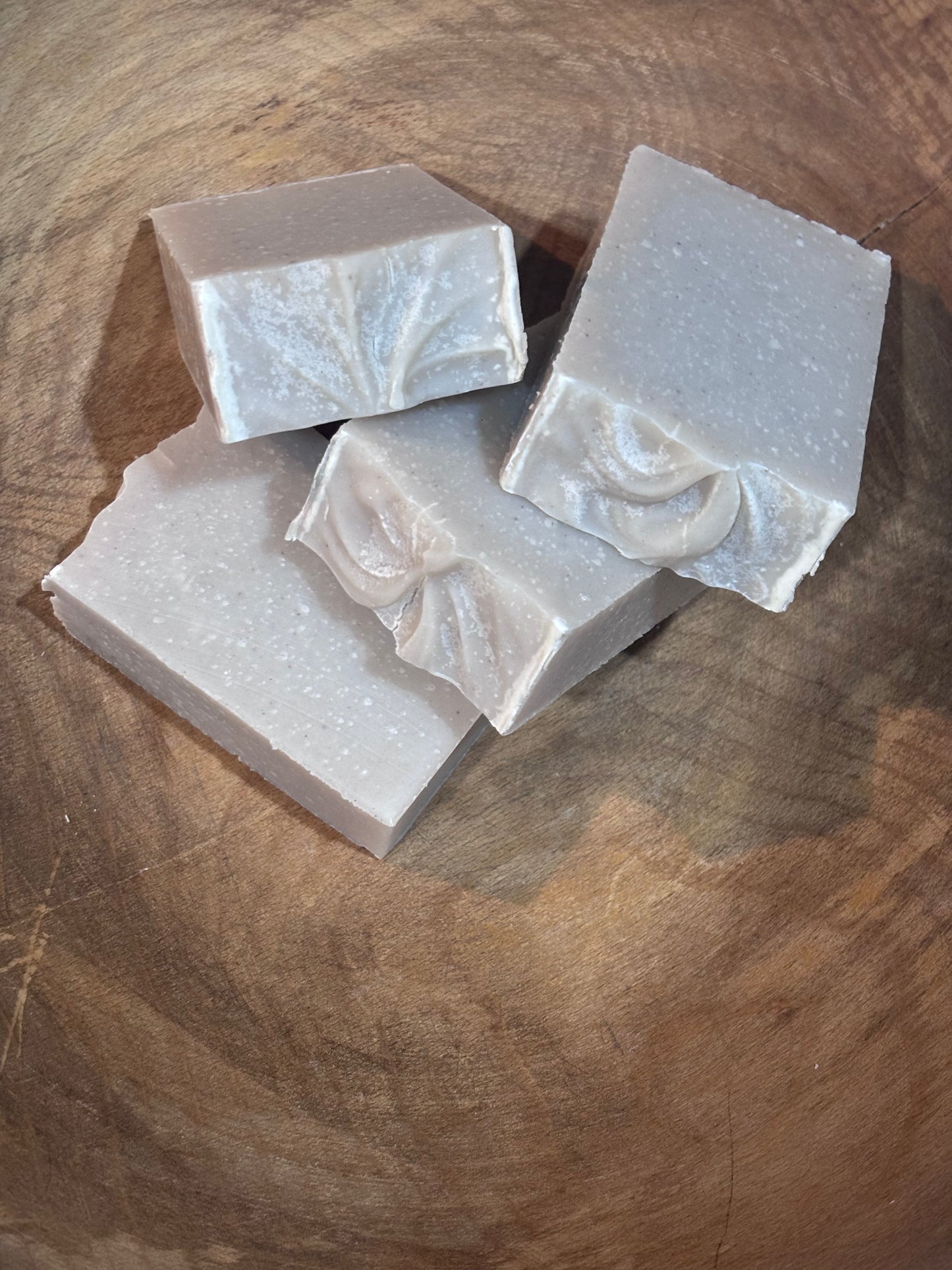 3 bars of soap in a wooden bowl.
A clean, fruity, herbaceous scent, Blackberry Jam contains distilled water, saponified oils of olive, palm, coconut, castor, avocado and cocoa butter and purple brazilian clay. 