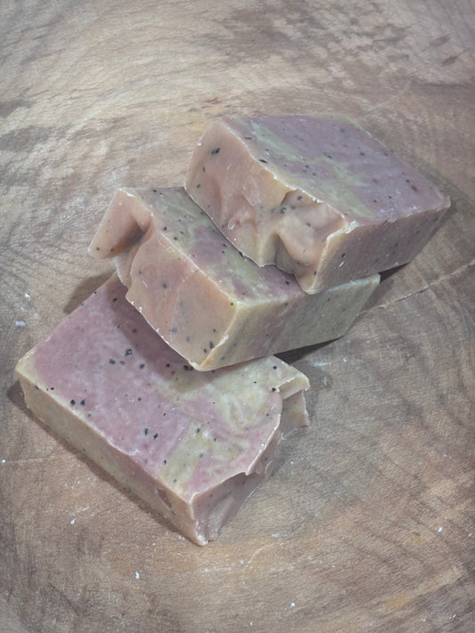 3 bars of pale yellow and pink soap on a wooden background.
Limited Edition! Rise N' Shine soap.
Scented with cinnamon, frankincense, orange, ginger and cedarwood essential oils. Colored with yellow brazilian clay and rose clay. Coffee grounds included. This has everything you need to wake you up! It will be fully cured just in time for Daylights Savings, on March 8th.
Ingredients include saponified oils of olive, palm, coconut, and castor; essential oil blend; ground coffee